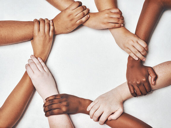 People, integration and hands together isolated on a white background in solidarity, support and diversity collaboration. Circle, strong and community power of women and men in synergy sign in studio.